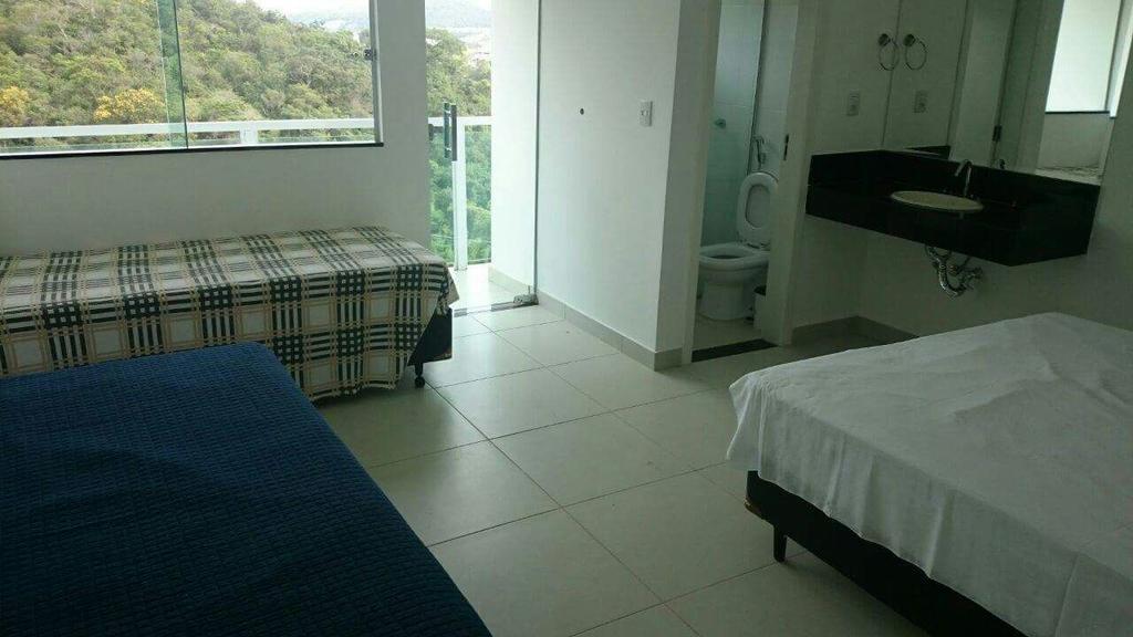 Apartamentos Mirante De Escarpas Capitólio Chambre photo